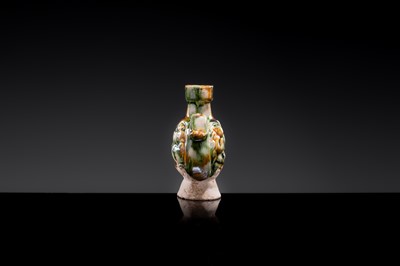 A MINIATURE SANCAI-GLAZED PILGRIM’S FLASK WITH MUSICIANS AND DUCKS, TANG DYNASTY