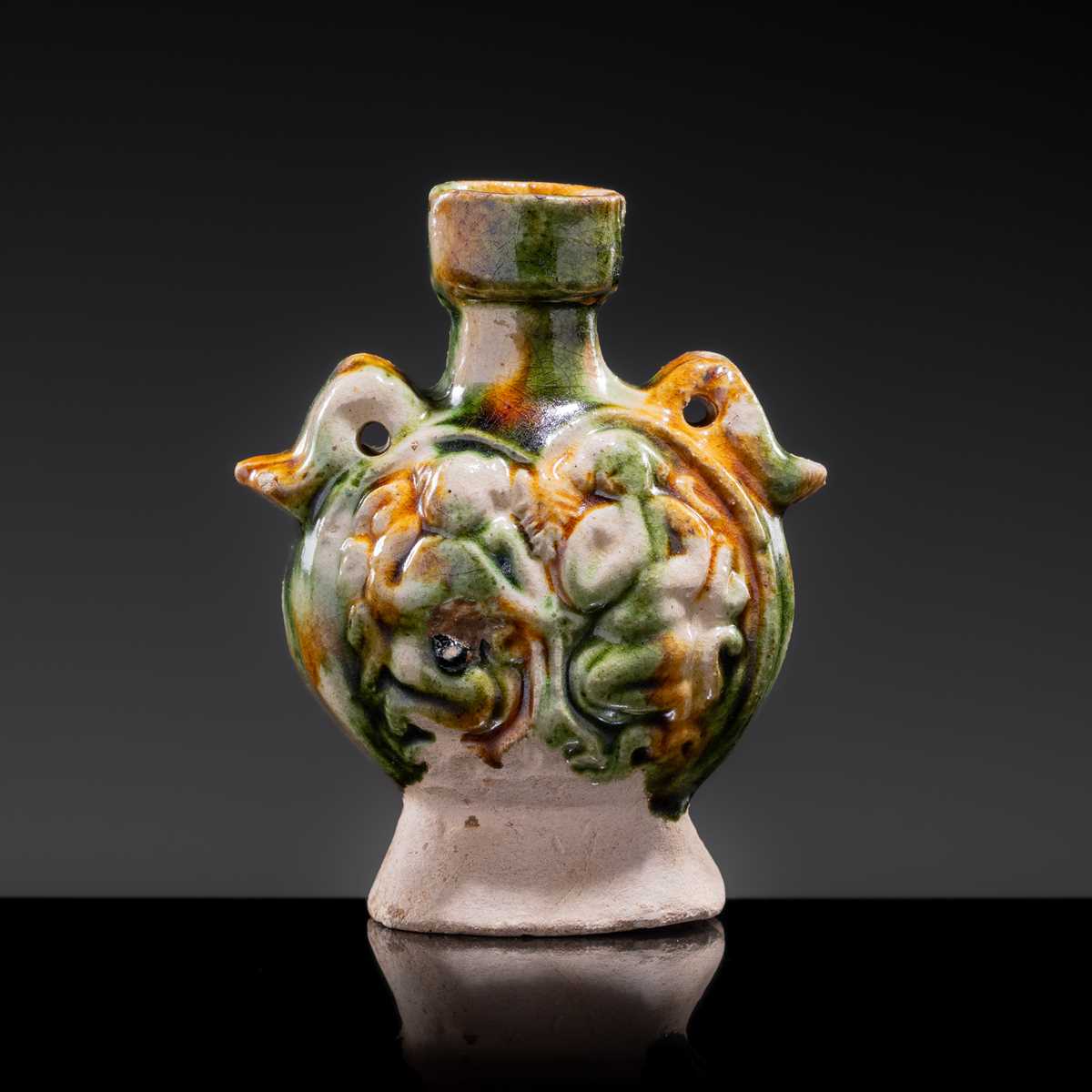 A MINIATURE SANCAI-GLAZED PILGRIM’S FLASK WITH MUSICIANS AND DUCKS, TANG DYNASTY