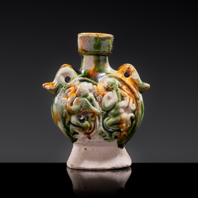 Lot 38 - A MINIATURE SANCAI-GLAZED PILGRIM’S FLASK WITH MUSICIANS AND DUCKS, TANG DYNASTY
