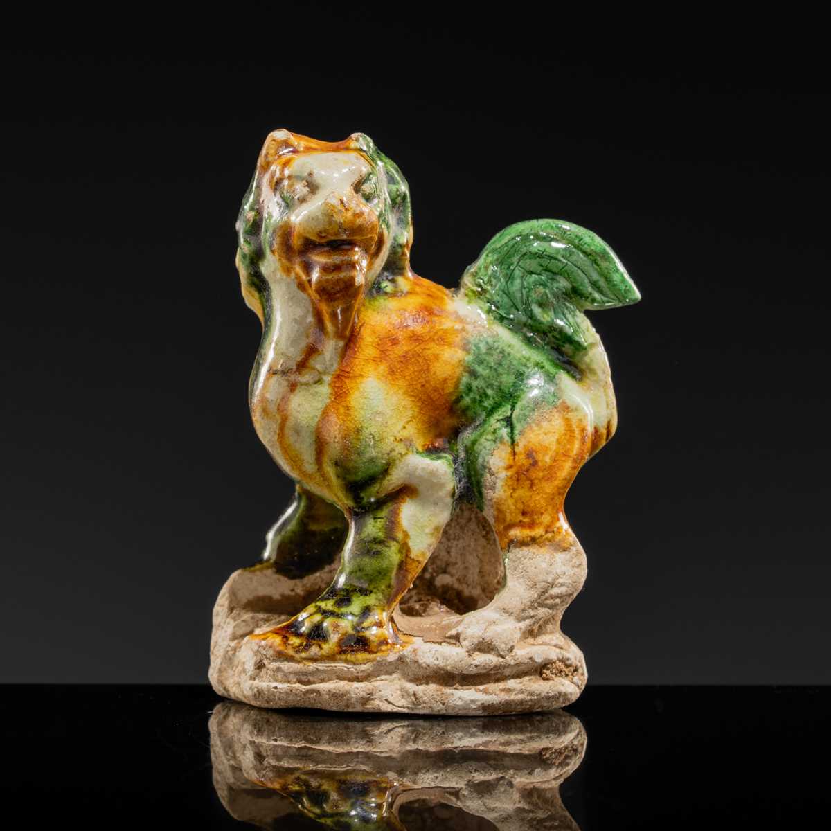 Lot 44 - A SANCAI-GLAZED POTTERY FIGURE OF A LION, TANG DYNASTY