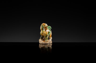 Lot 44 - A SANCAI-GLAZED POTTERY FIGURE OF A LION, TANG DYNASTY
