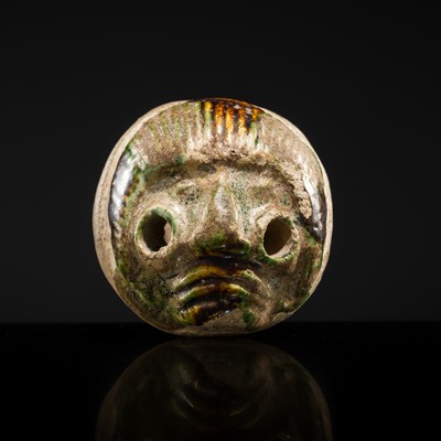 Lot 50 - A SANCAI GLAZED POTTERY WHISTLE IN THE FORM OF A FOREIGNER HEAD, TANG DYNASTY