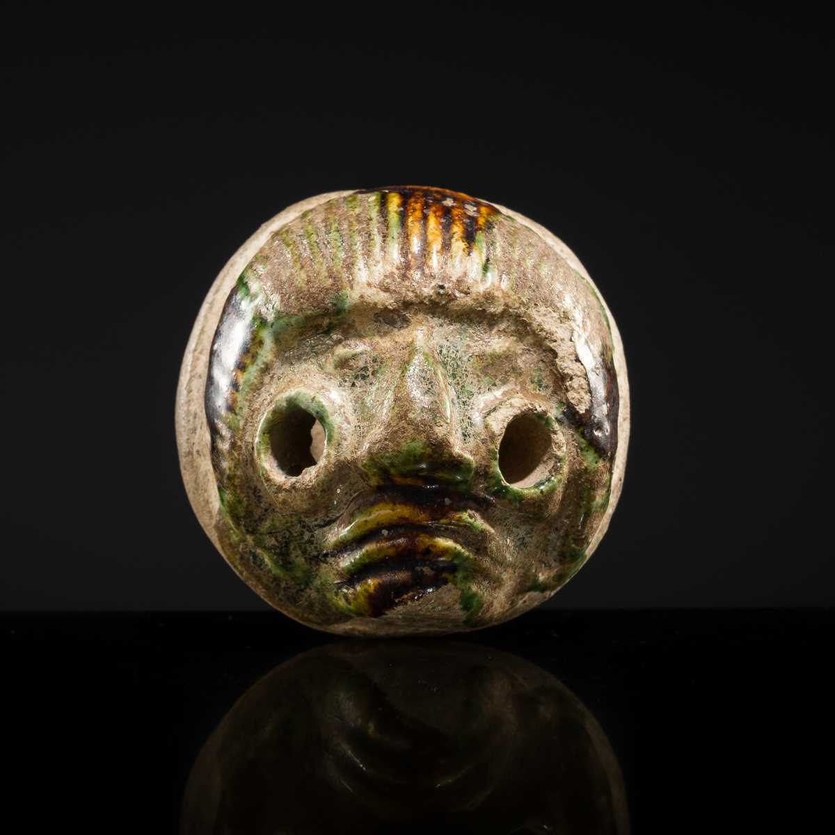 Lot 50 - A SANCAI GLAZED POTTERY WHISTLE IN THE FORM OF A FOREIGNER HEAD, TANG DYNASTY