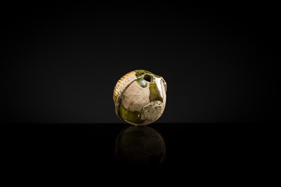 Lot 47 - A SANCAI GLAZED POTTERY ‘MASK’ WHISTLE, TANG DYNASTY