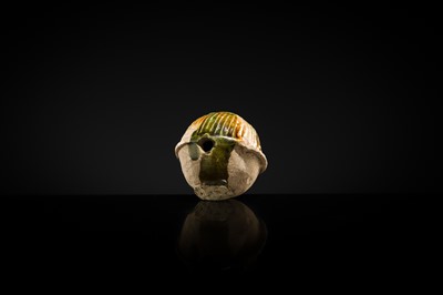 Lot 47 - A SANCAI GLAZED POTTERY ‘MASK’ WHISTLE, TANG DYNASTY