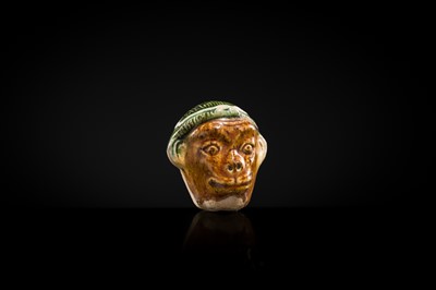 Lot 46 - A ‘MONKEY’S HEAD’ SANCAI GLAZED EARTHENWARE FIGURE, TANG DYNASTY