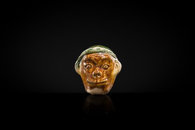 Lot 46 - A ‘MONKEY’S HEAD’ SANCAI GLAZED EARTHENWARE FIGURE, TANG DYNASTY