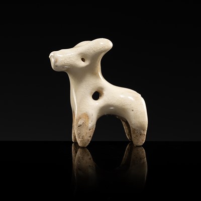 Lot 62 - A WHITE GLAZED XINGYAO POTTERY TOGGLE IN THE FORM OF A DEER, SONG DYNASTY