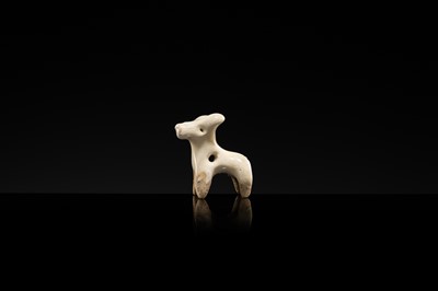 Lot 62 - A WHITE GLAZED XINGYAO POTTERY TOGGLE IN THE FORM OF A DEER, SONG DYNASTY