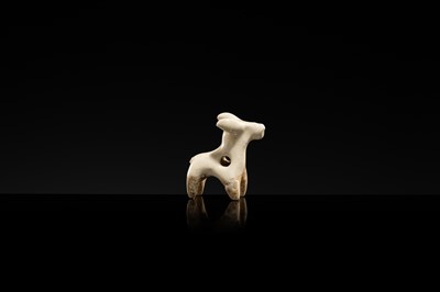 Lot 62 - A WHITE GLAZED XINGYAO POTTERY TOGGLE IN THE FORM OF A DEER, SONG DYNASTY