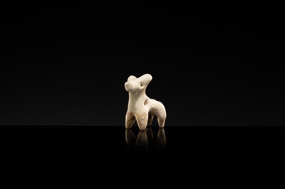 Lot 62 - A WHITE GLAZED XINGYAO POTTERY TOGGLE IN THE FORM OF A DEER, SONG DYNASTY