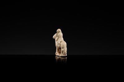 Lot 56 - A SMALL WHITE GLAZED CIZHOU FIGURE OF A BOY ON HORSEBACK, LIAO DYNASTY