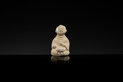 A RARE DINGYAO STONEWARE FIGURE OF A BOY DRUMMER, SONG DYNASTY