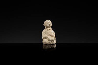 A RARE DINGYAO STONEWARE FIGURE OF A BOY DRUMMER, SONG DYNASTY