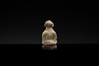 A RARE DINGYAO STONEWARE FIGURE OF A BOY DRUMMER, SONG DYNASTY