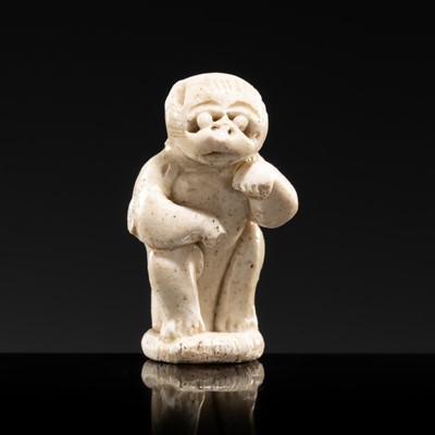 Lot 72 - A SMALL WHITE GLAZED DINGYAO FIGURE OF A MONKEY, NORTHERN SONG DYNASTY