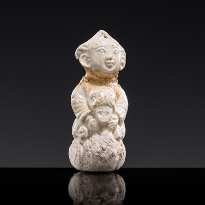 Lot 73 - A SMALL WHITE GLAZED DINGYAO FIGURE OF A BOY RIDING A DUCK, NORTHERN SONG DYNASTY