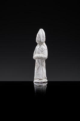 Lot 57 - A SMALL WHITE GLAZED DINGYAO FIGURE OF A PRIEST (MUSHI), LIAO DYNASTY