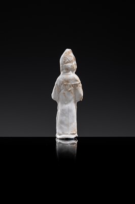 Lot 57 - A SMALL WHITE GLAZED DINGYAO FIGURE OF A PRIEST (MUSHI), LIAO DYNASTY