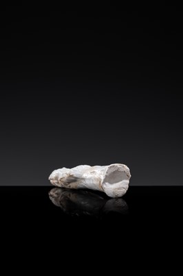 Lot 57 - A SMALL WHITE GLAZED DINGYAO FIGURE OF A PRIEST (MUSHI), LIAO DYNASTY