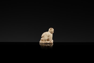 A WHITE GLAZED DINGYAO MINIATURE FIGURE OF A CRAWLING TODDLER (HEJI), NORTHERN SONG DYNASTY