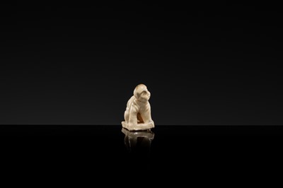 A WHITE GLAZED DINGYAO MINIATURE FIGURE OF A CRAWLING TODDLER (HEJI), NORTHERN SONG DYNASTY