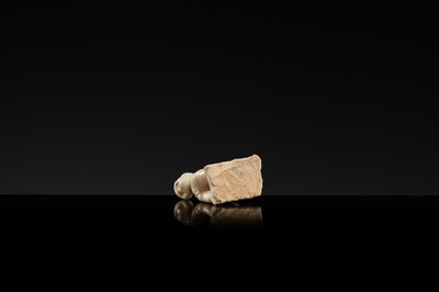 A WHITE GLAZED DINGYAO MINIATURE FIGURE OF A CRAWLING TODDLER (HEJI), NORTHERN SONG DYNASTY