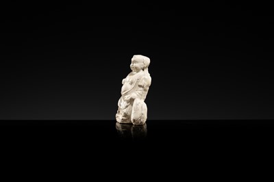 A DINGYAO STONEWARE FIGURE OF BUDAI, LIAO DYNASTY