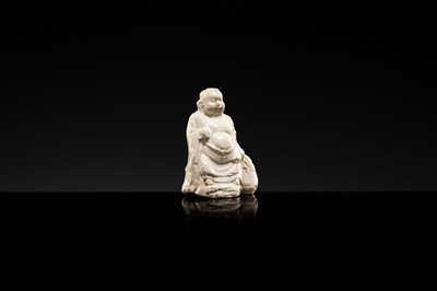 A DINGYAO STONEWARE FIGURE OF BUDAI, LIAO DYNASTY