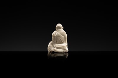 A DINGYAO STONEWARE FIGURE OF BUDAI, LIAO DYNASTY