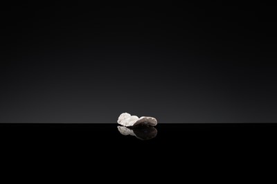 Lot 85 - A SMALL WHITE GLAZED DINGYAO FIGURE OF A BOY CARRYING A TODDLER, NORTHERN SONG DYNASTY