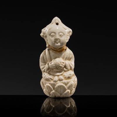 Lot 80 - A SMALL WHITE GLAZED DINGYAO FIGURE OF A GIRL SEATED ON A LOTUS BLOSSOM, NORTHERN SONG DYNASTY