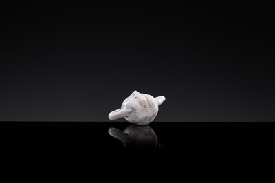 Lot 52 - A MINIATURE DINGYAO WHITE GLAZED ‘WALNUT’ EWER, LIAO DYNASTY