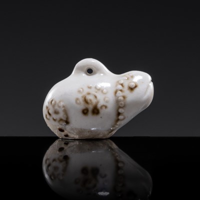 Lot 70 - A SMALL WHITE GLAZED DINGYAO FIGURE OF A TOAD, SONG DYNASTY