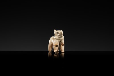 Lot 63 - A SMALL WHITE GLAZED DINGYAO FIGURE OF A DOG, SONG DYNASTY