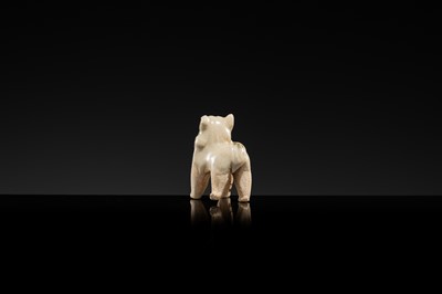 Lot 63 - A SMALL WHITE GLAZED DINGYAO FIGURE OF A DOG, SONG DYNASTY