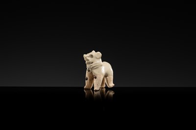 Lot 63 - A SMALL WHITE GLAZED DINGYAO FIGURE OF A DOG, SONG DYNASTY