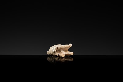 Lot 63 - A SMALL WHITE GLAZED DINGYAO FIGURE OF A DOG, SONG DYNASTY