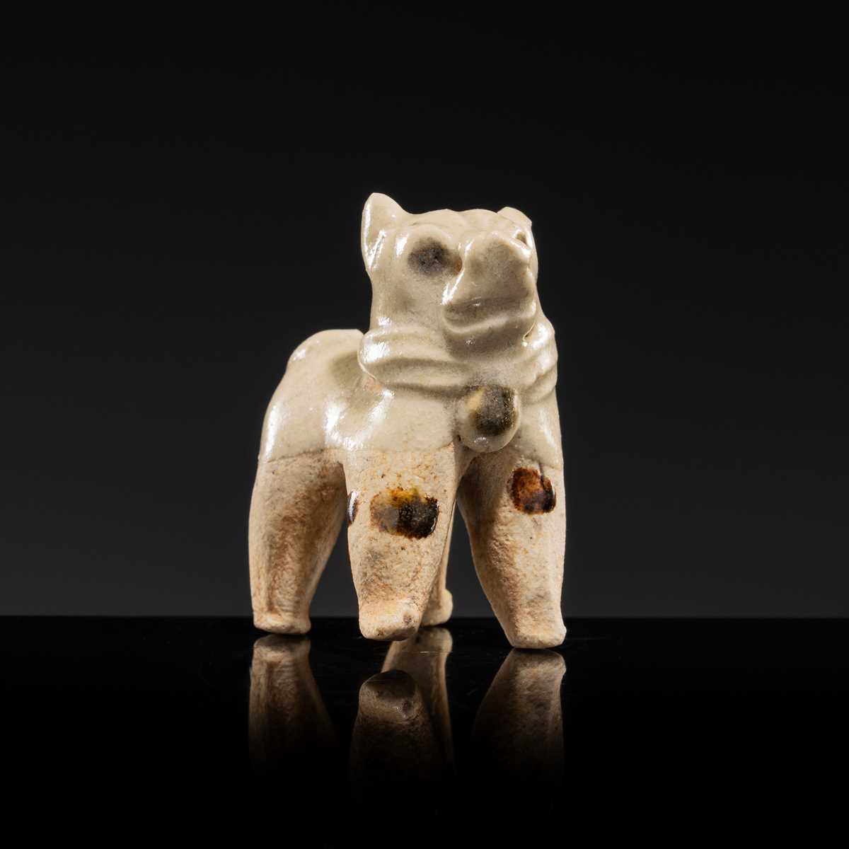 Lot 63 - A SMALL WHITE GLAZED DINGYAO FIGURE OF A DOG, SONG DYNASTY