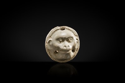 Lot 48 - A GLAZED POTTERY WHISTLE IN THE FORM OF A MONKEY’S HEAD, FIVE DYNASTIES PERIOD