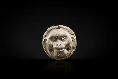 Lot 48 - A GLAZED POTTERY WHISTLE IN THE FORM OF A MONKEY’S HEAD, FIVE DYNASTIES PERIOD