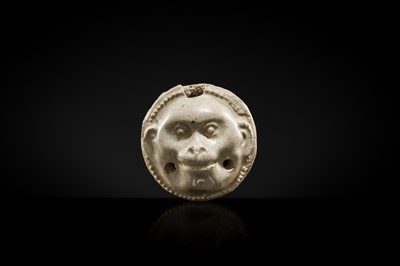 Lot 48 - A GLAZED POTTERY WHISTLE IN THE FORM OF A MONKEY’S HEAD, FIVE DYNASTIES PERIOD