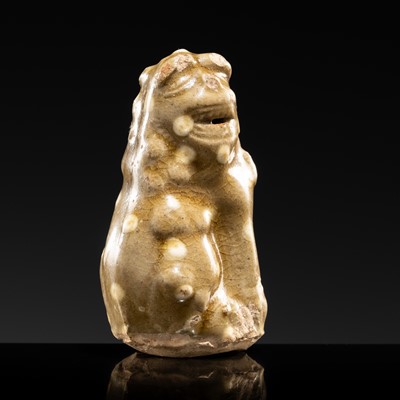 Lot 69 - A YAOZHOU STONEWARE CELADON FIGURE OF A FELINE, NORTHERN SONG DYNASTY