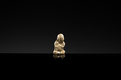 A YAOZHOU STONEWARE FIGURE OF A GIRL WITH A MELON, NORTHERN SONG DYNASTY