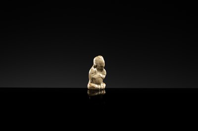 A YAOZHOU STONEWARE FIGURE OF A GIRL WITH A MELON, NORTHERN SONG DYNASTY