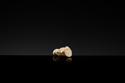 A YAOZHOU STONEWARE FIGURE OF A GIRL WITH A MELON, NORTHERN SONG DYNASTY