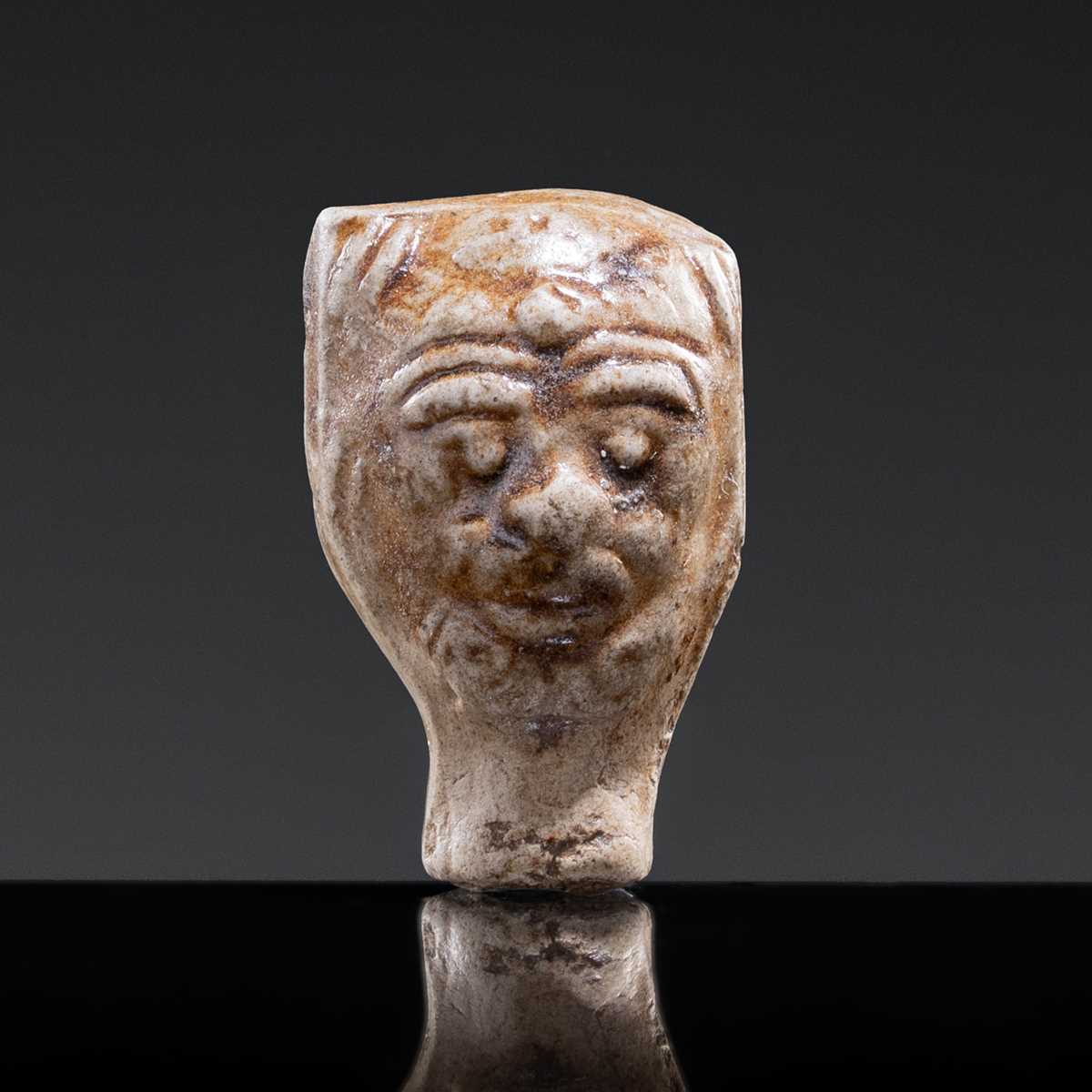 Lot 51 - A GLAZED POTTERY WHISTLE IN THE FORM OF THE HEAD OF A FOREIGNER, LATE TANG DYNASTY