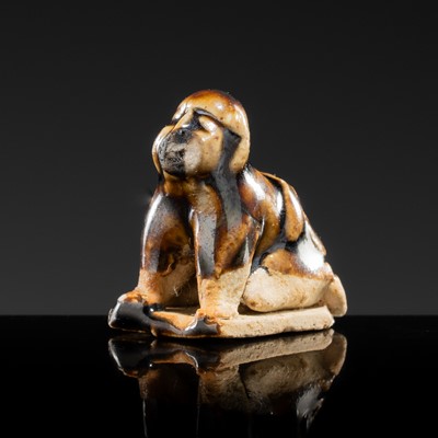 Lot 88 - A GLAZED POTTERY FIGURE OF A TODDLER, NORTHERN SONG DYNASTY