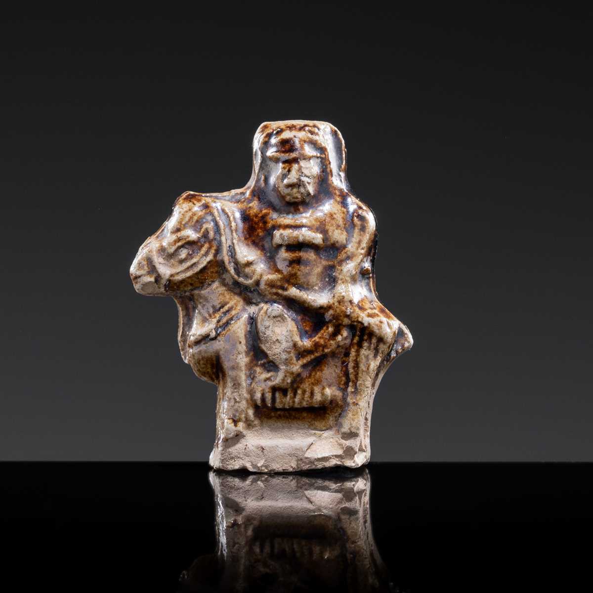 A GLAZED POTTERY WHISTLE IN THE FORM OF A MAN ON HORSEBACK, SONG TO YUAN DYNASTY