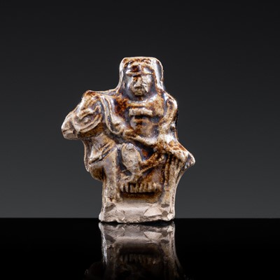 Lot 103 - A GLAZED POTTERY WHISTLE IN THE FORM OF A MAN ON HORSEBACK, SONG TO YUAN DYNASTY